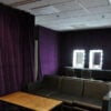 pipe and drape in a back stage environment with sofas and make-up mirrors