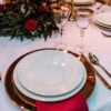 gold allure cutlery, gold patterned glassware and gold wide rim charger plate