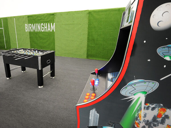arcade machine and table football in the player lounge for major sporting event