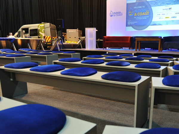 grey seminar benches with blue seat pads for exhibition and conference delegates