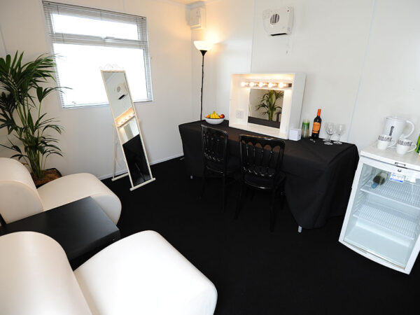 white leather unit chairs, cheval mirror, make up mirror and drinks fridge