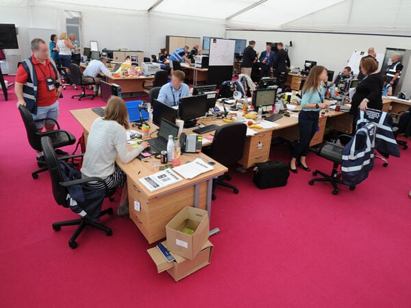 a bustling event production office with office furniture