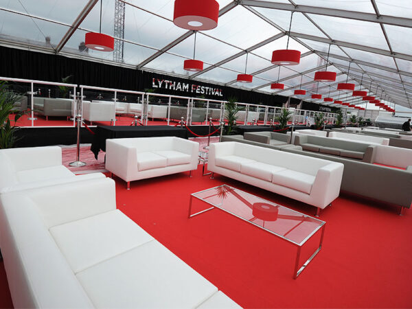 White and grey sofas with glass coffee table at lytham festival