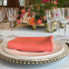 gold rimmed glassware with gold beaded glass charger plates and gold allure cutlery