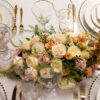 gold rimmed glassware with gold beaded glass charger plates and gold allure cutlery