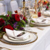 gold rimmed glassware with gold beaded glass charger plates and gold allure cutlery