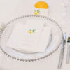 guest star cutlery with silver rim beaded glass charger plate on wedding table