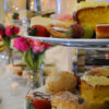 cakes and fruit on two tiered cake stand