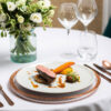 enamor copper cutlery with coupe plate and grand cepage glassware