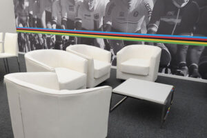 Create casual seating areas with white leather Monaco club chairs