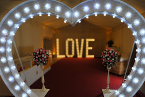 Illuminated wedding heart arch hire