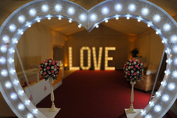 Illuminated wedding heart arch hire