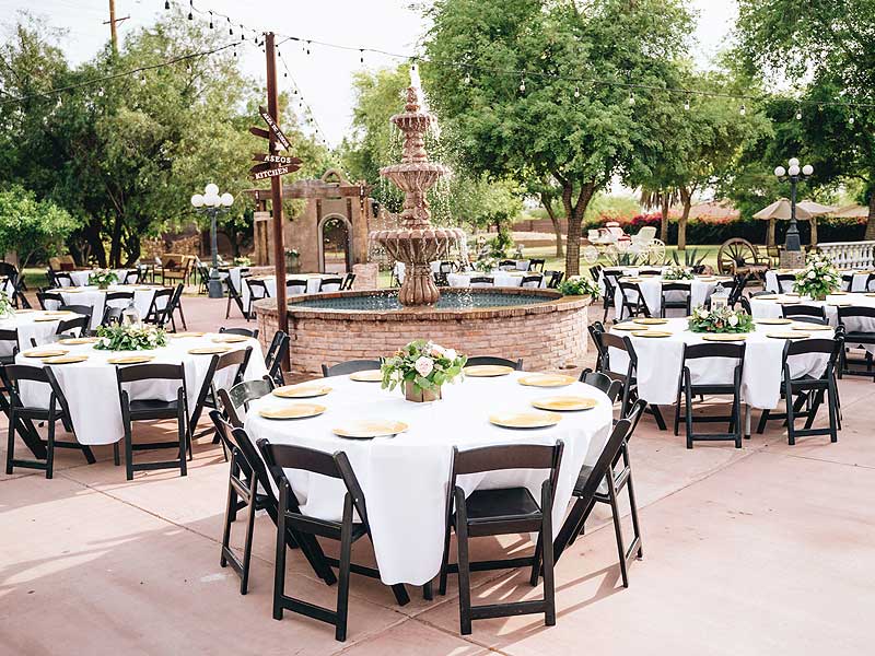 What should I consider when choosing tables for an outdoor wedding?